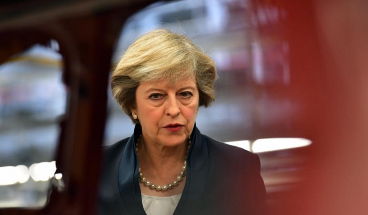Șefa Guvernului de la Londra, Theresa May, va fi marea absentă de la cina de lucru consacrată Brexitului
