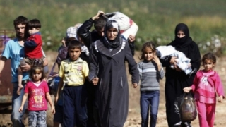 Turcia este pregătită să-și deschidă frontiera sirienilor care fug din Alep