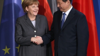 Şoc în politica externă: Merkel a bătut palma cu China