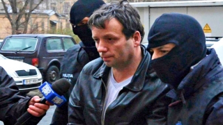 Hackerul „Guccifer“, adus din SUA în România pentru ispăşirea pedepsei