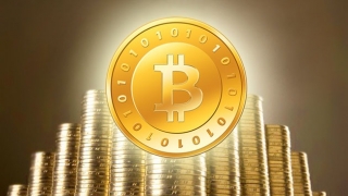 Moneda digitală Bitcoin a întrecut pentru prima dată aurul