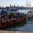 GALERIE FOTO. Zeci de migranţi aflaţi pe o navă din lemn au fost transportaţi în Portul Constanţa